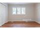 Spacious bedroom featuring hardwood floors and ample natural light at 904 Grove St, Chapel Hill, NC 27517