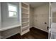 Laundry room with built-in shelving, a window, and plenty of storage at 40 Longbow Dr, Middlesex, NC 27557
