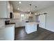 Modern kitchen with white cabinets, quartz countertops, and stainless steel appliances at 40 Longbow Dr, Middlesex, NC 27557