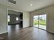 Bright dining area with hardwood floors and sliding glass doors to backyard at 40 Longbow Dr, Middlesex, NC 27557