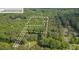 Aerial view of property lines of a wooded lot near a road at 2222 Umstead Rd, Durham, NC 27712