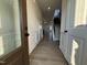 Bright entryway with hardwood floors and an open view to the stairs and living room at 116 Commons Cir # 229, Clayton, NC 27520