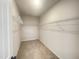 Large walk-in closet with wire shelving and hanging rods at 116 Commons Cir # 229, Clayton, NC 27520