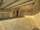 Unfinished two-car garage with concrete floor and open space at 116 Commons Cir # 229, Clayton, NC 27520