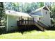 Two-story house with gray siding, deck and backyard at 7647 Cummings Dr, Mebane, NC 27302