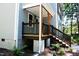 Charming front porch with wooden railings and steps at 7647 Cummings Dr, Mebane, NC 27302