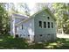 Two-story house with gray siding, deck, and backyard at 7647 Cummings Dr, Mebane, NC 27302