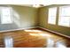 Spacious bedroom with hardwood floors and large windows at 7647 Cummings Dr, Mebane, NC 27302
