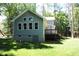 Two-story house with gray siding, deck and backyard at 7647 Cummings Dr, Mebane, NC 27302