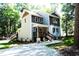 Two-story house with gray and brown siding, front porch, and stairs at 7647 Cummings Dr, Mebane, NC 27302