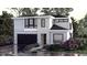 Two-story modern home with stone accents and a two-car garage at 809 Antoine Dr # 3, Durham, NC 27713