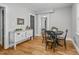 Charming dining area with a rustic table and chairs, hardwood floors at 2704 Barmettler St, Raleigh, NC 27607