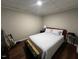 Simple bedroom with a double bed and guitar at 124 Don Ron Rd, Erwin, NC 28339
