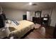Bright bedroom with hardwood floors and large bed at 124 Don Ron Rd, Erwin, NC 28339