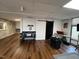 Large common area with hardwood floors and plenty of natural light at 124 Don Ron Rd, Erwin, NC 28339