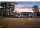 Metal building with exterior lighting at sunset at 124 Don Ron Rd, Erwin, NC 28339
