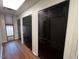 Long hallway with hardwood floors and multiple closets at 124 Don Ron Rd, Erwin, NC 28339