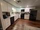 Modern kitchen with white cabinets and dark appliances at 124 Don Ron Rd, Erwin, NC 28339