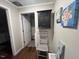 Convenient laundry room with washer, dryer, and shelving at 124 Don Ron Rd, Erwin, NC 28339