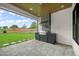 Outdoor kitchen with built-in grill and stone flooring at 1804 Stream Manor Ct, Wake Forest, NC 27587
