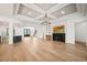 Open concept great room with hardwood floors, fireplace, and built-in shelving at 1804 Stream Manor Ct, Wake Forest, NC 27587