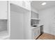 White kitchen cabinets and a quartz countertop with a farmhouse sink at 162 Lookout Rdg # 677, Pittsboro, NC 27312