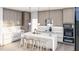 Modern kitchen with an island, white cabinets, and upscale appliances at 824 Antoine Dr # 8, Durham, NC 27713