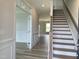 Bright entryway with hardwood floors and staircase leading upstairs at 106 Ausban Rdg Ln # 002, Four Oaks, NC 27524