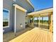 Gray house exterior with a screened porch and wooden deck at 106 Ausban Rdg Ln # 002, Four Oaks, NC 27524
