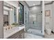 Spa-like bathroom with a walk-in shower, marble flooring, and modern fixtures at 1312 Hunting Ridge Rd, Raleigh, NC 27615