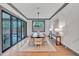 Elegant dining room with a large window, chandelier, and built-in wall features at 1312 Hunting Ridge Rd, Raleigh, NC 27615