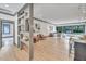 Open living room with hardwood floors and built-in shelving at 1312 Hunting Ridge Rd, Raleigh, NC 27615