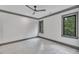 Bright bedroom with hardwood floors and large windows at 1312 Hunting Ridge Rd, Raleigh, NC 27615