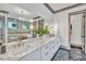 Elegant bathroom with marble countertops, double sinks, and a large mirror at 1312 Hunting Ridge Rd, Raleigh, NC 27615