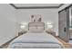 Bright bedroom with a comfortable bed, nightstands, and a sliding barn door at 1312 Hunting Ridge Rd, Raleigh, NC 27615