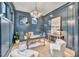 Home office with built-in shelving and a large window at 1312 Hunting Ridge Rd, Raleigh, NC 27615