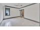 Bright bedroom with barn door to ensuite bathroom and ceiling fan at 1312 Hunting Ridge Rd, Raleigh, NC 27615