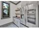 Modern kitchen with stainless steel appliances and gray cabinets at 1312 Hunting Ridge Rd, Raleigh, NC 27615