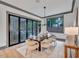 Bright dining room with a large table and access to the outdoors at 1312 Hunting Ridge Rd, Raleigh, NC 27615