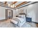 Spacious main bedroom with a king-size bed and built in bench at 1312 Hunting Ridge Rd, Raleigh, NC 27615