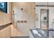 Spa-like shower with walk-in glass enclosure and modern fixtures at 1312 Hunting Ridge Rd, Raleigh, NC 27615