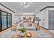 Spacious living room with light-colored sofa and access to patio at 1312 Hunting Ridge Rd, Raleigh, NC 27615