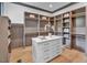 Spacious walk-in closet with ample shelving and drawer space at 1312 Hunting Ridge Rd, Raleigh, NC 27615