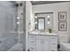 Clean bathroom with a walk-in shower and modern vanity at 1312 Hunting Ridge Rd, Raleigh, NC 27615