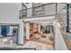 Open concept living area with high ceilings and modern staircase at 1312 Hunting Ridge Rd, Raleigh, NC 27615