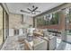 Outdoor kitchen with stainless steel appliances and seating area at 1312 Hunting Ridge Rd, Raleigh, NC 27615