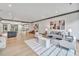 Spacious living room featuring hardwood floors and a comfortable seating area at 1312 Hunting Ridge Rd, Raleigh, NC 27615