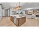 Spacious kitchen with island, stainless steel appliances, and hardwood floors at 1312 Hunting Ridge Rd, Raleigh, NC 27615