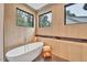 Relaxing bathroom with freestanding soaking tub and stylish tile at 1312 Hunting Ridge Rd, Raleigh, NC 27615