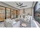 Outdoor kitchen with built-in grill, refrigerator, and seating area at 1312 Hunting Ridge Rd, Raleigh, NC 27615